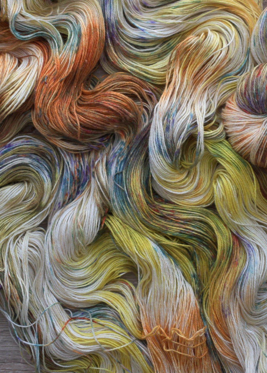 Hand dyed silk and linen sock weight yarn.