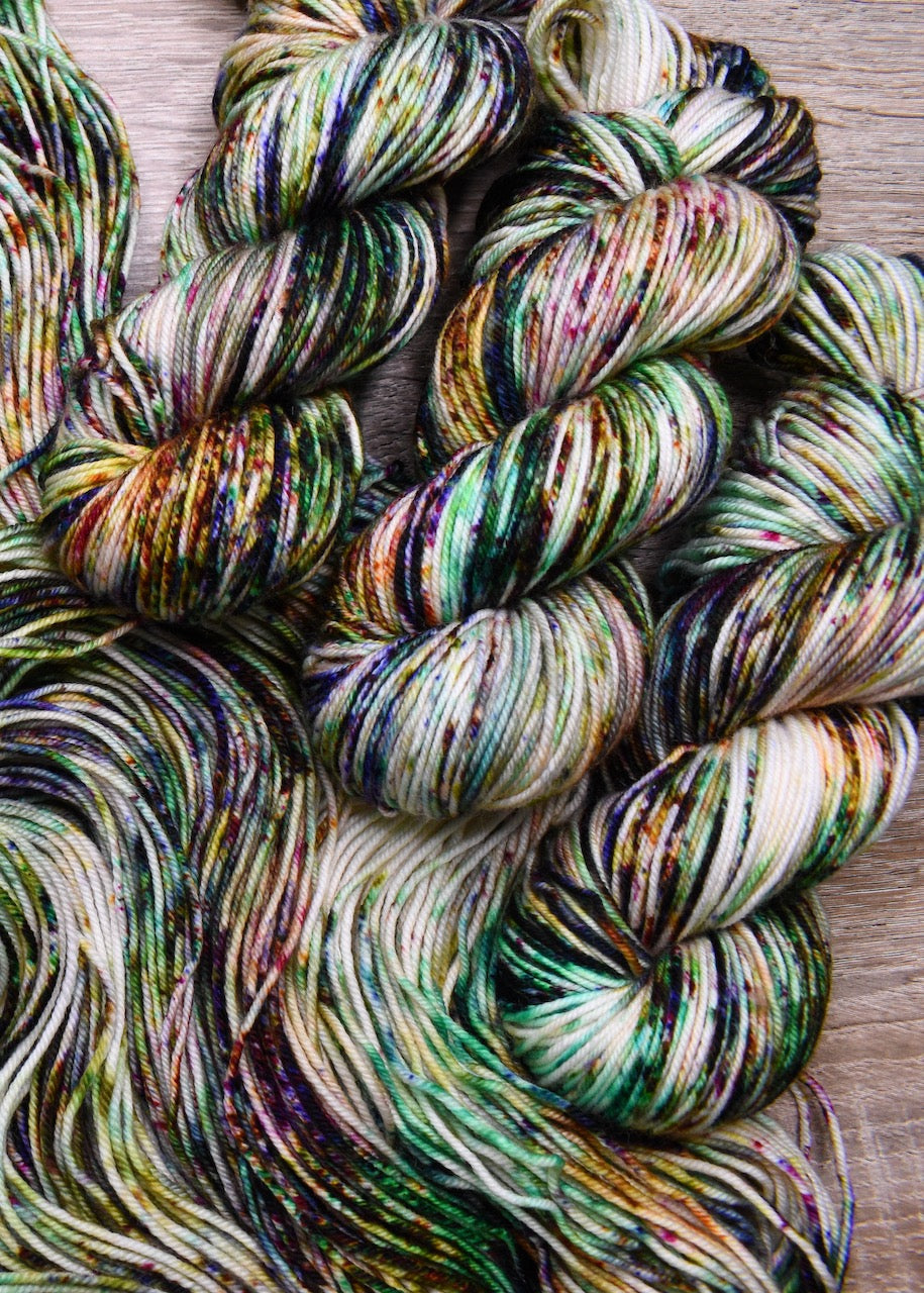 Multi colour speckled hand dyed merino yarn.