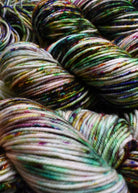 Multi colour speckled hand dyed merino yarn.