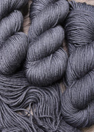 Gray hand dyed 100% wool yarn.