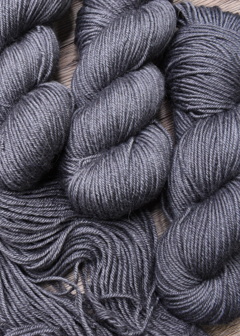 Gray hand dyed 100% wool yarn.