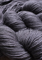 Gray hand dyed 100% wool yarn.