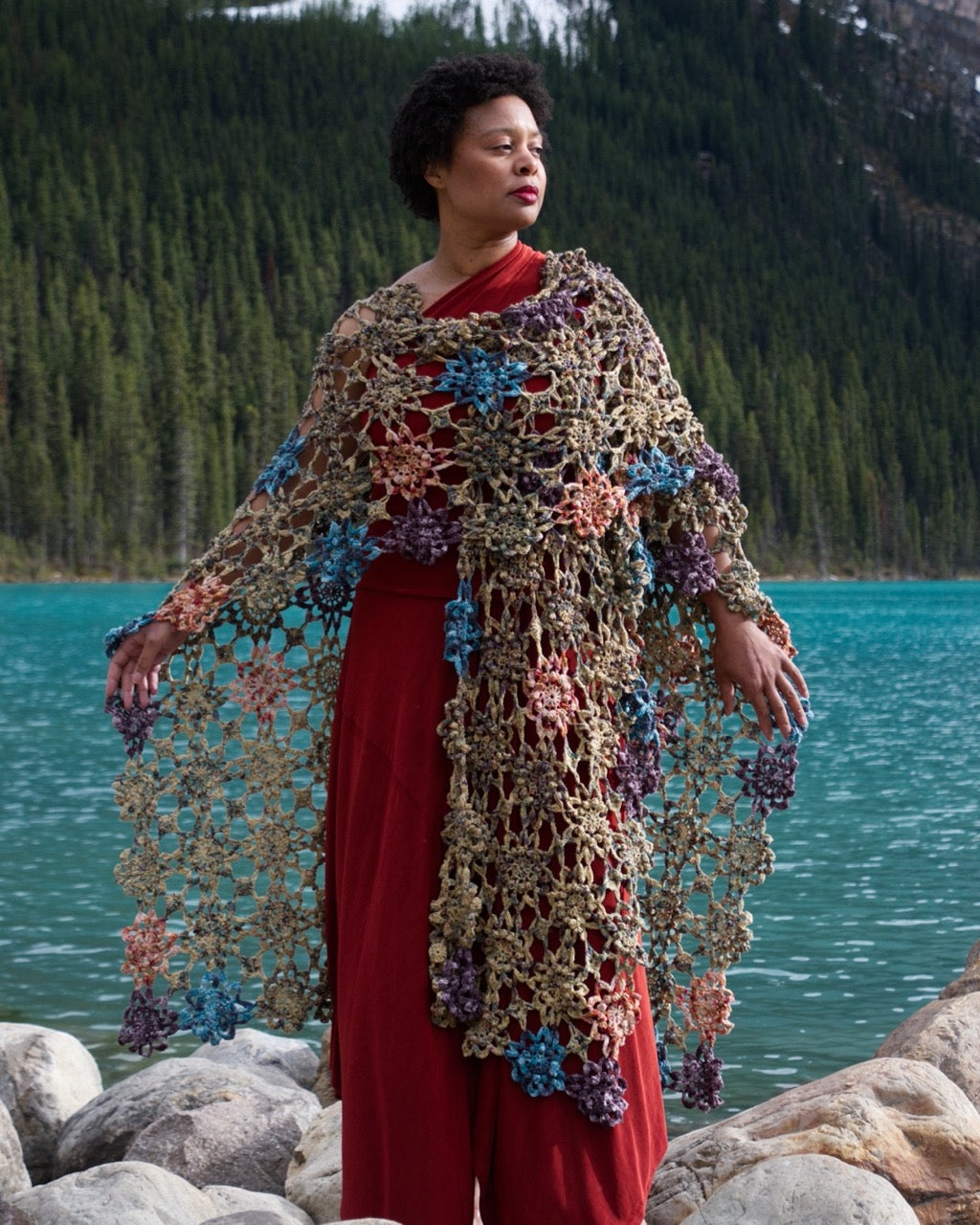 Crochet shawl pattern with motifs using hand dyed yarn.