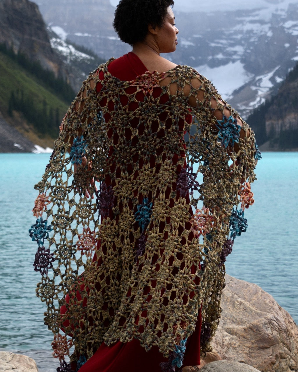 Crochet shawl pattern with motifs using hand dyed yarn.