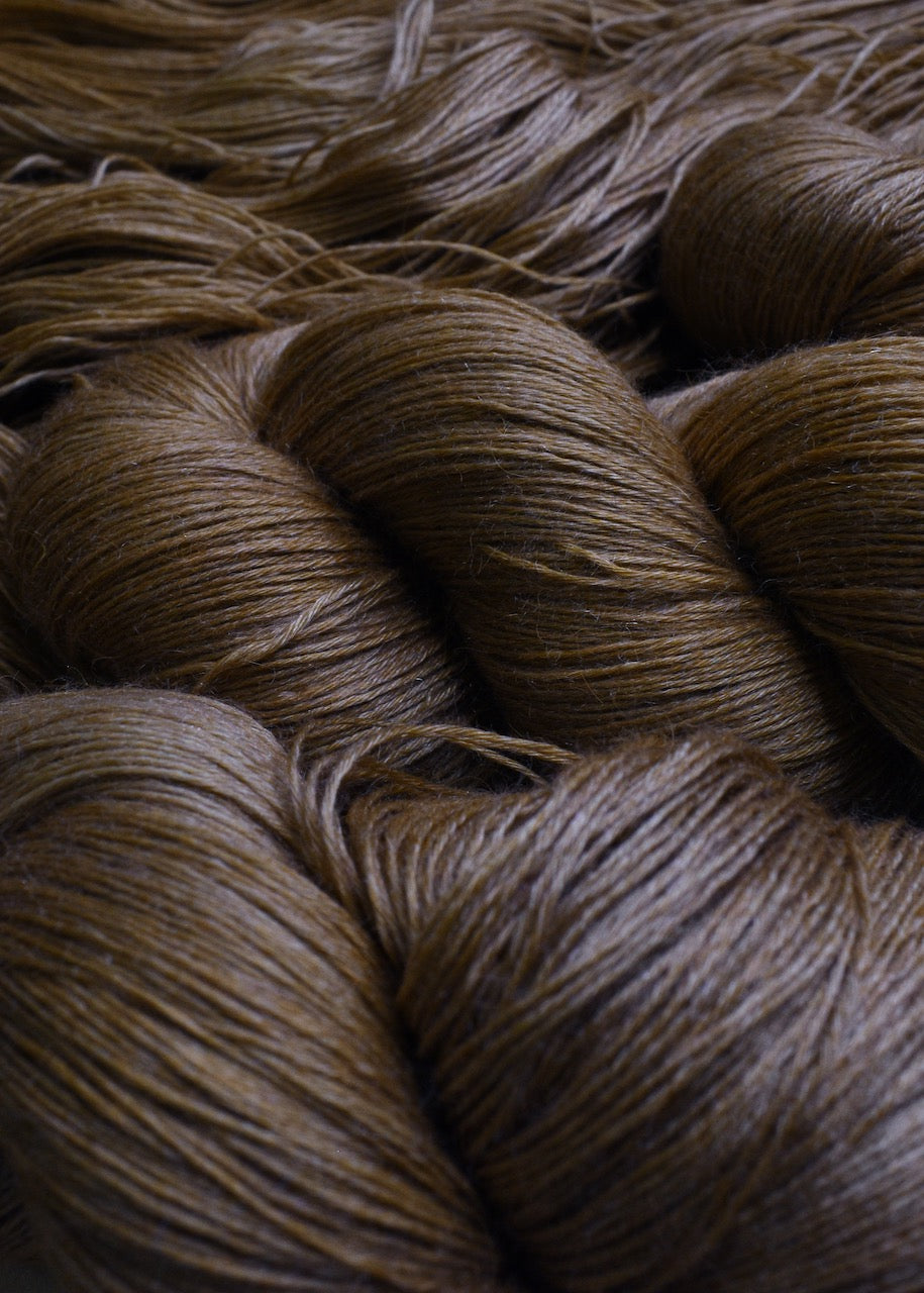 Light brown hand dyed lace yarn.