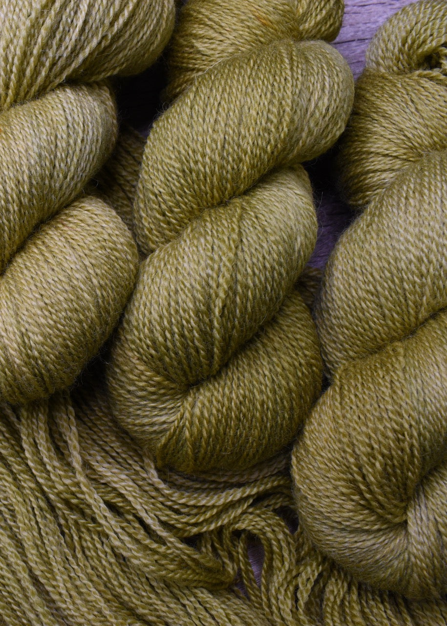 Soft yellow green wool yarn hand dyed.