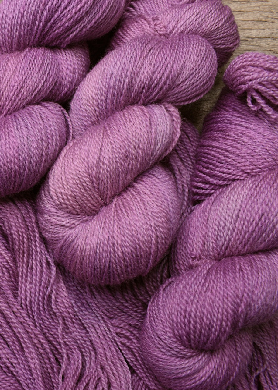 Pink wool hand dyed sock yarn.