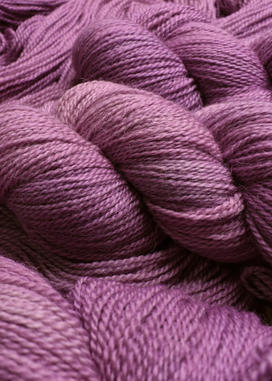 Pink wool hand dyed sock yarn.