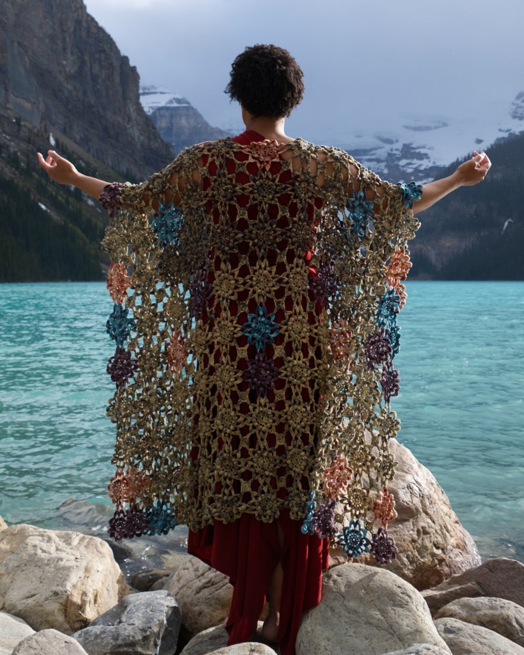 Crochet shawl pattern with motifs using hand dyed yarn.
