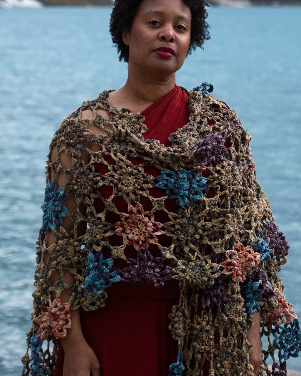 Crochet shawl pattern with motifs using hand dyed yarn.