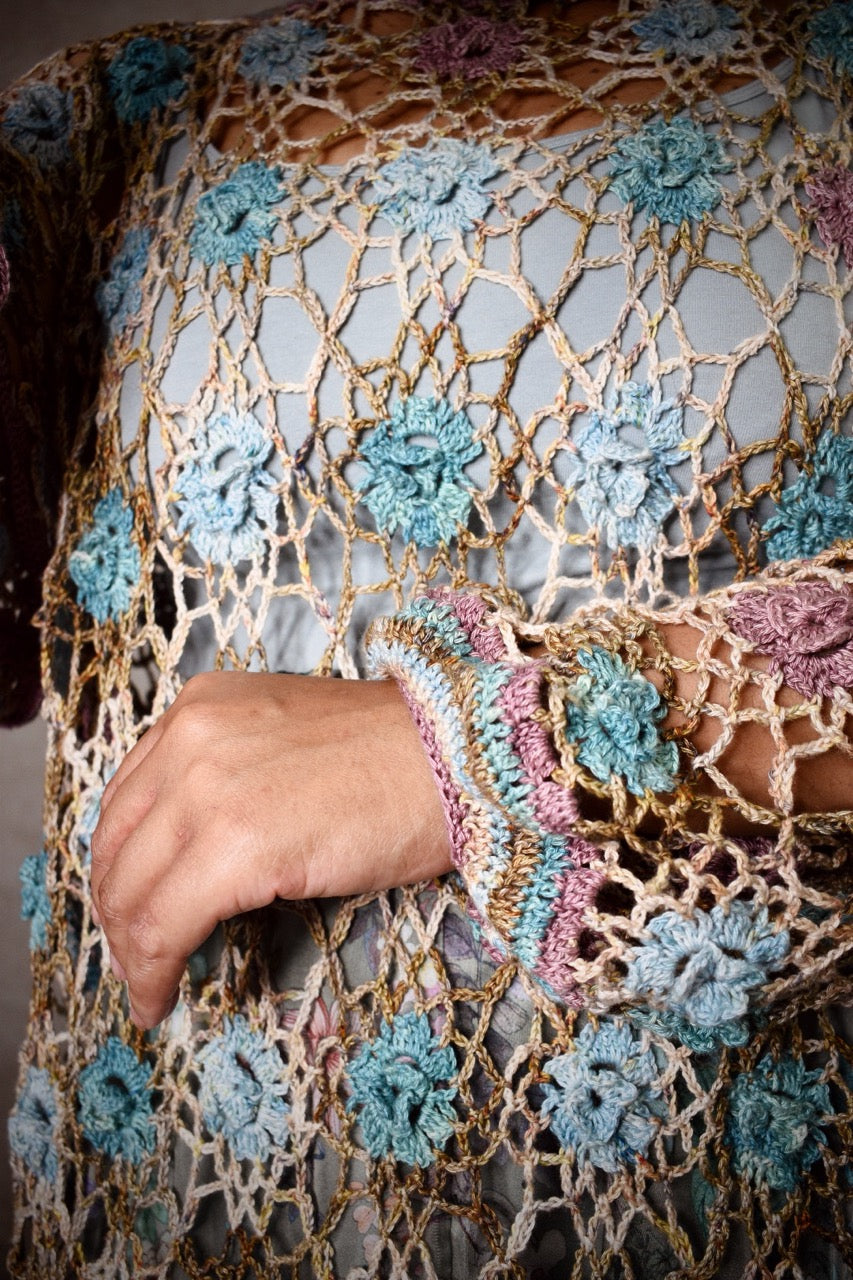 Crochet lace sweater pattern using hand dyed silk yarn.