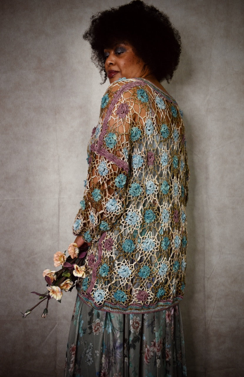 Crochet lace sweater pattern using hand dyed silk yarn.