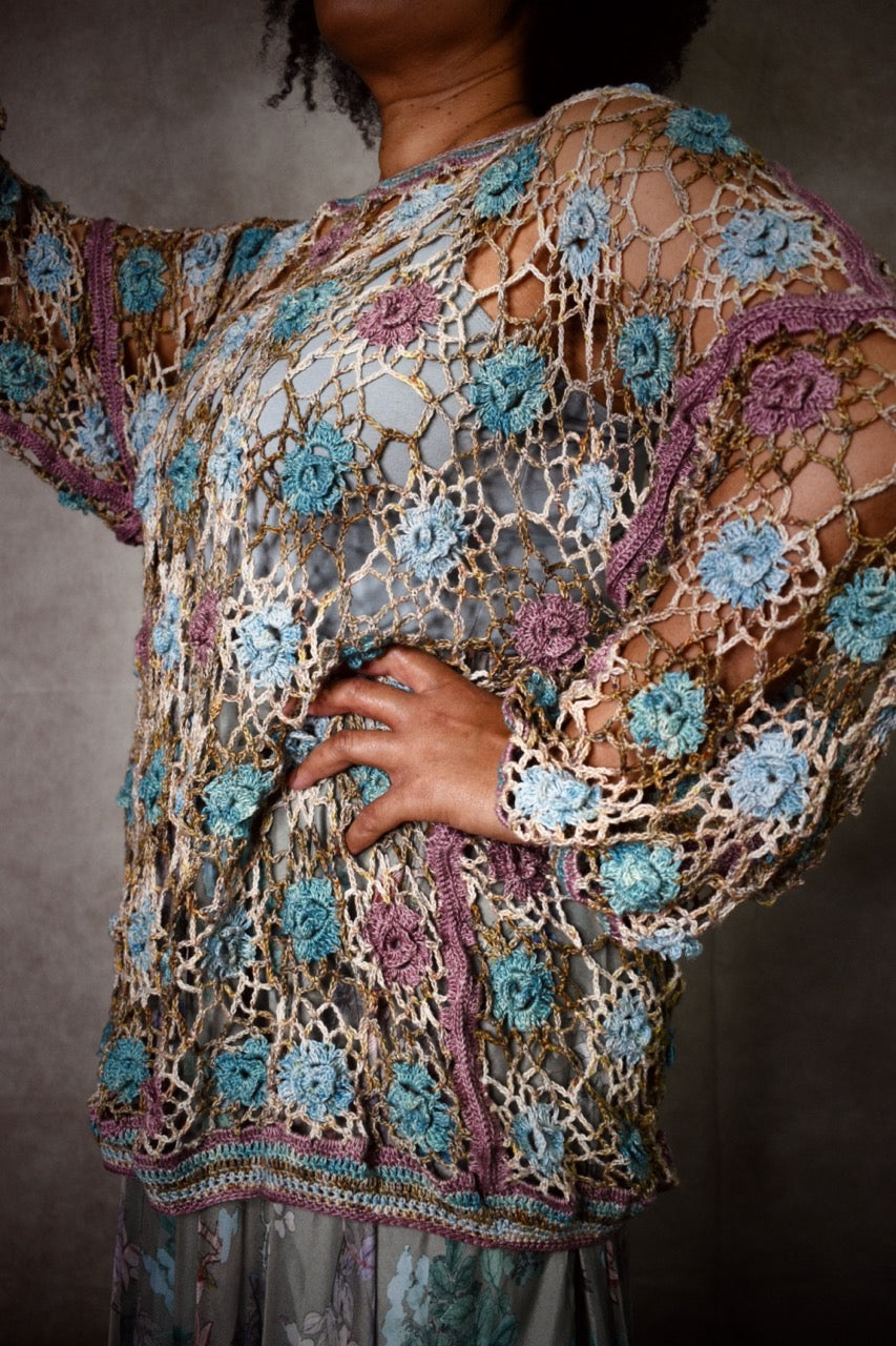 Crochet lace sweater pattern using hand dyed silk yarn.