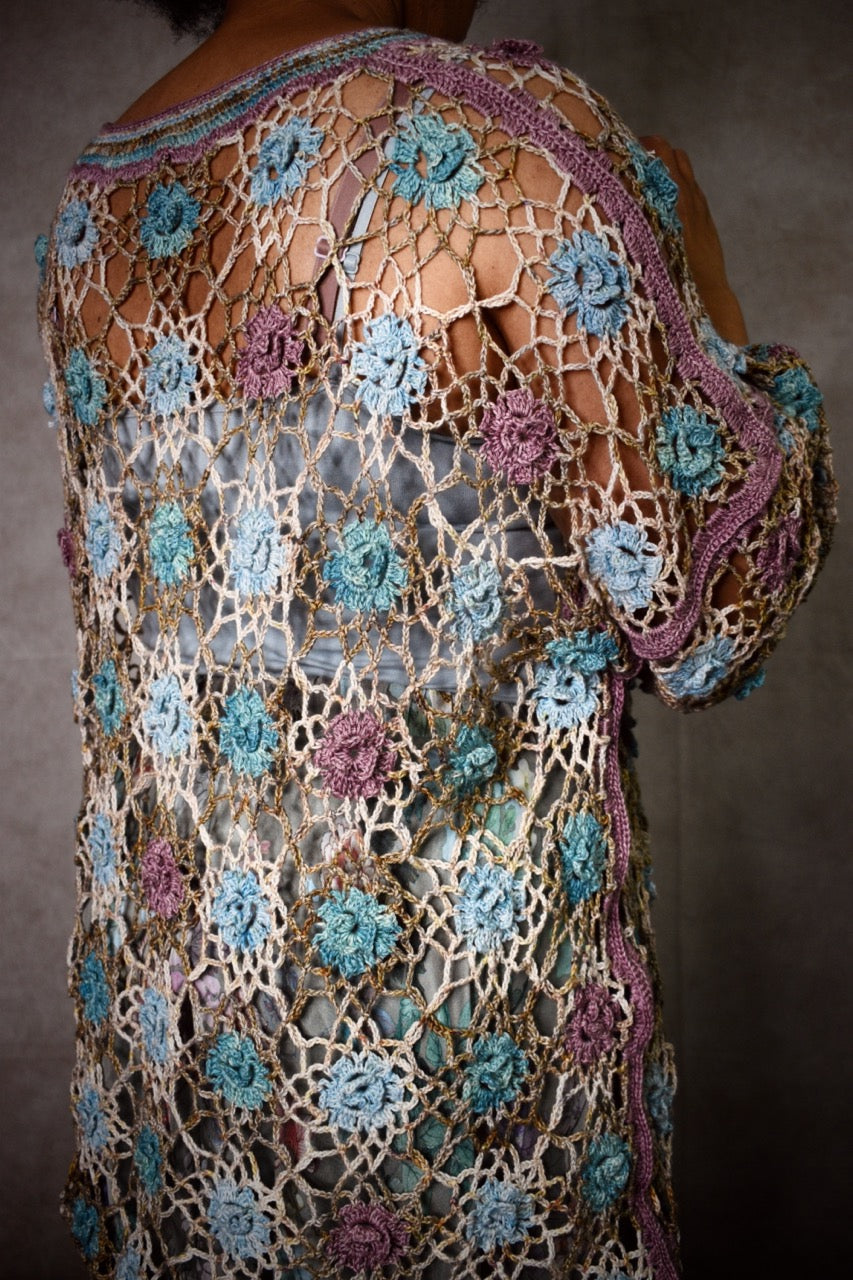 Crochet lace sweater pattern using hand dyed silk yarn.