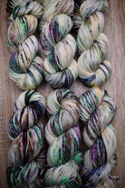 Multi colour speckles hand dyed on merino sport weight yarn.