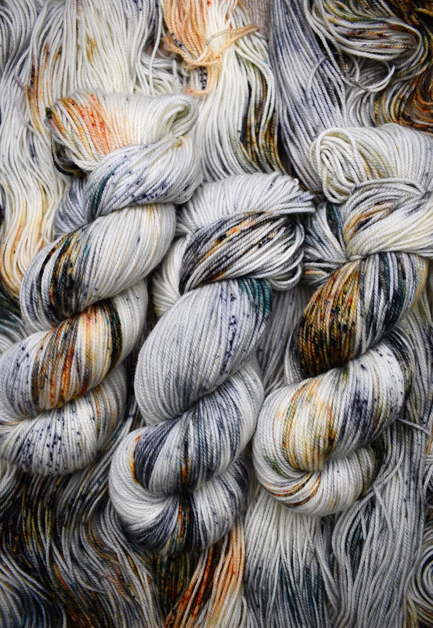 Speckled hand dyed merino yarn.