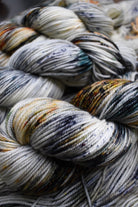 Speckled hand dyed merino yarn.