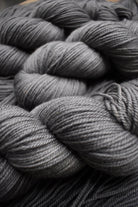 Hand dyed bfl wool yarn in gray colour.
