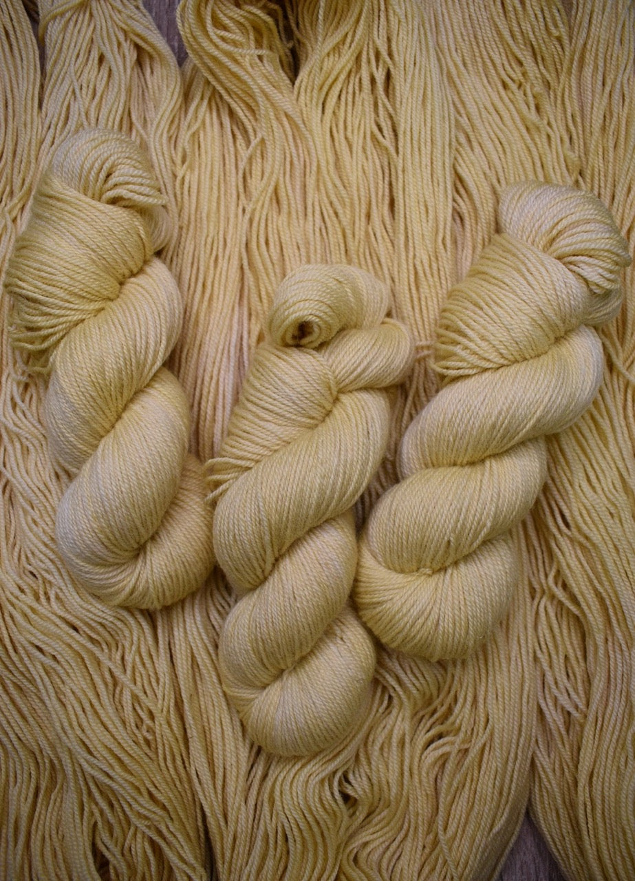 Sport weight yarn hand dyed cream colour.