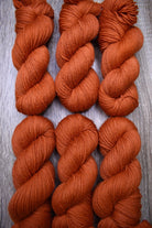 Orange hand dyed wool yarn.