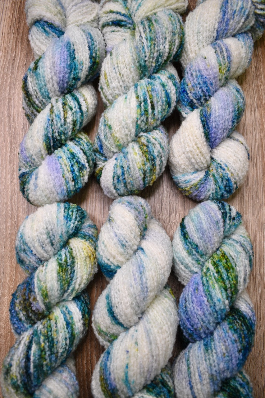 Boucle,  dk merino wool yarn, in colour Allium.