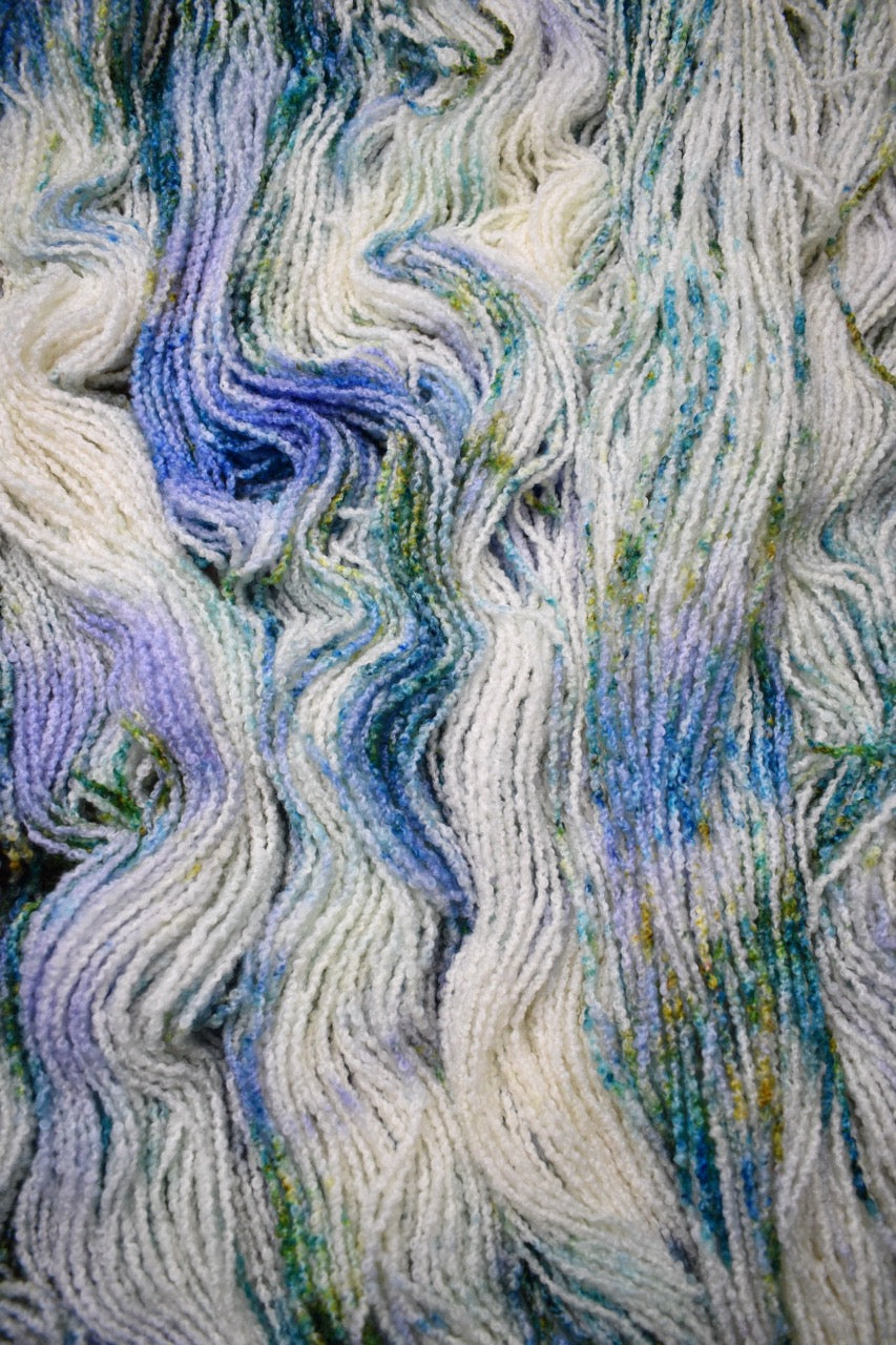 Boucle,  dk merino wool yarn, in colour Allium.