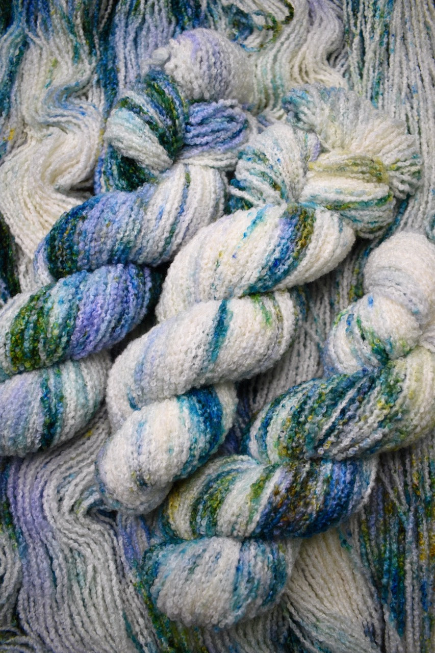 Boucle,  dk merino wool yarn, in colour Allium.