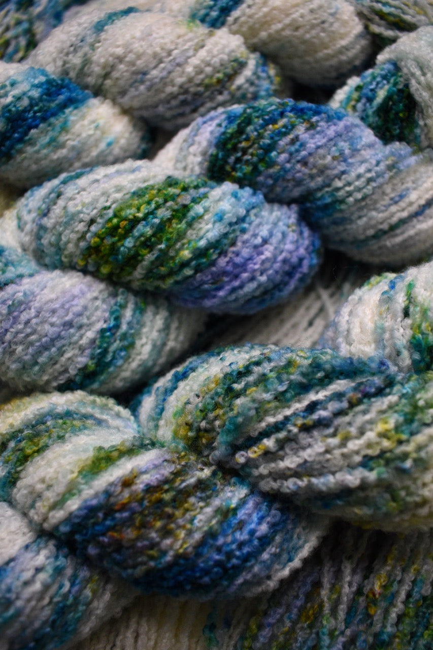 Boucle,  dk merino wool yarn, in colour Allium.