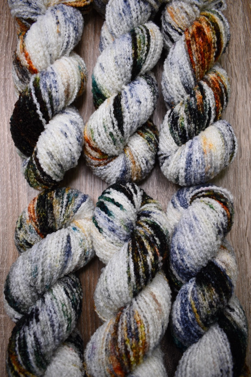 Hand dyed merino yarn, boucle texture, colour Koi Pond.