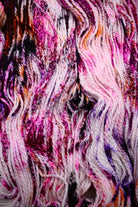 Hand dyed bulky merino wool yarn pink orange purple.