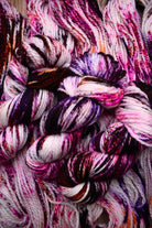 Hand dyed bulky merino wool yarn pink orange purple.