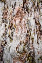 Brown and gold speckled hand dyed merino bulky yarn.