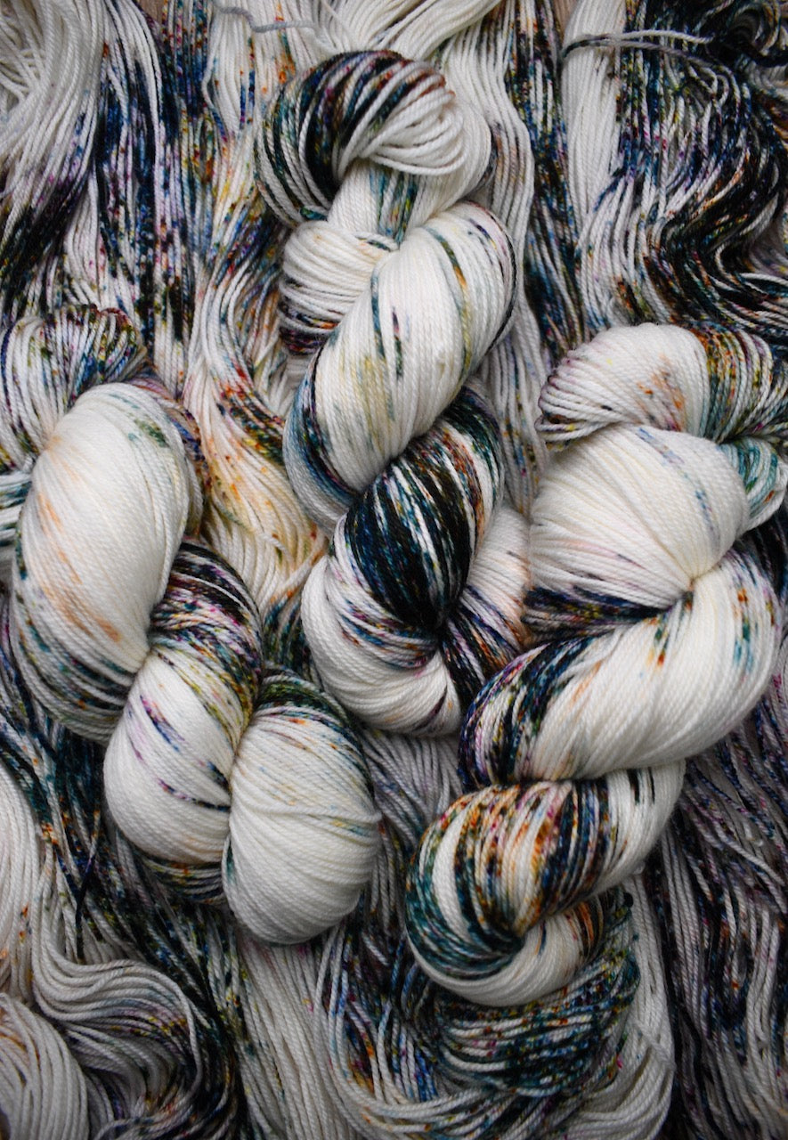 Speckled colourful hand dyed merino sock yarn.