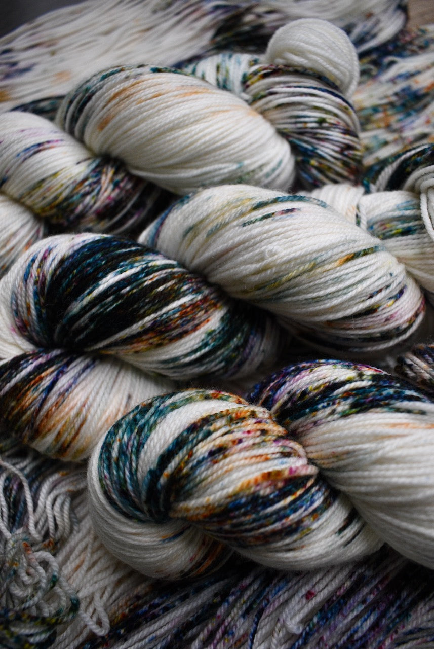 Speckled colourful hand dyed merino sock yarn.