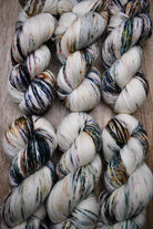 Speckled colourful hand dyed merino sock yarn.