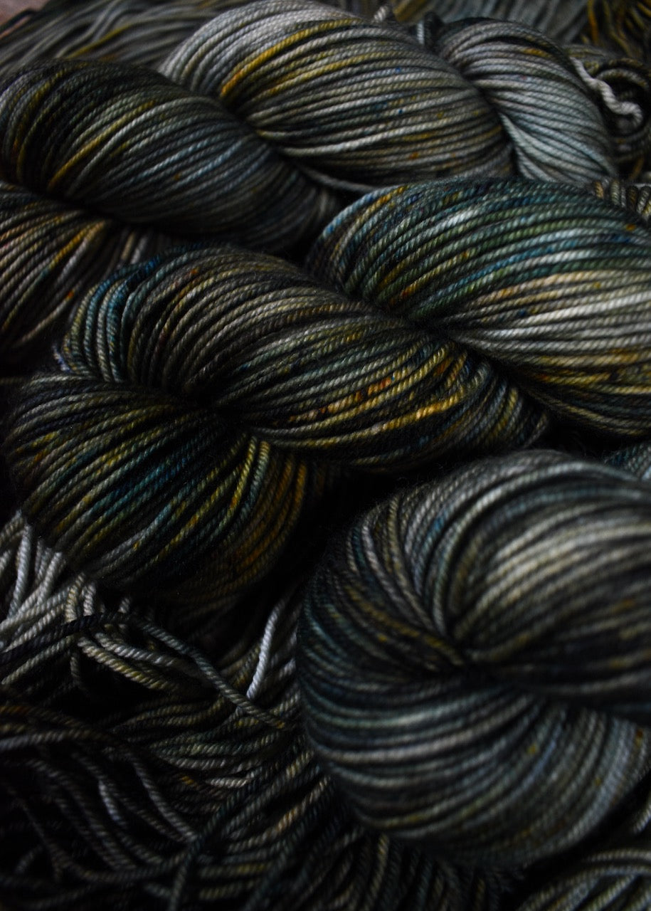 Speckled gray green merino hand dyed yarn.