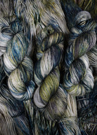 Light gray and green speckled wool sock yarn hand dyed.