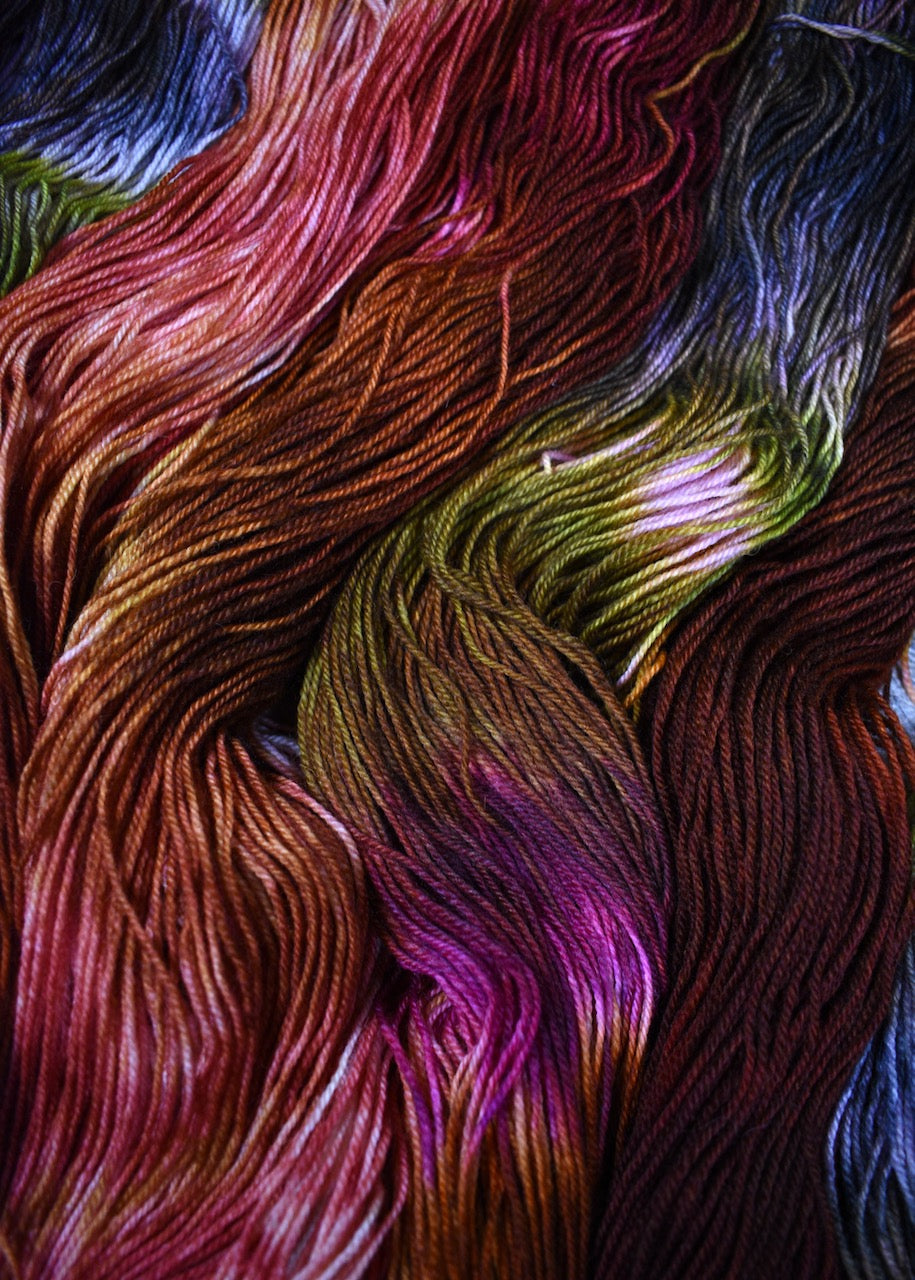 Pink green and brown hand dyed wool sock yarn.