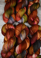 Pink green and brown hand dyed wool sock yarn.