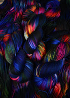 Blue red yellow and green hand dyed wool sock yarn.