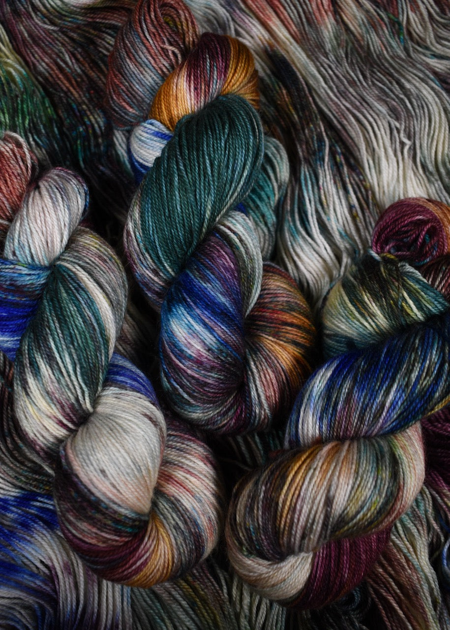 A variety of colour speckles on hand dyed bfl wool sock yarn.