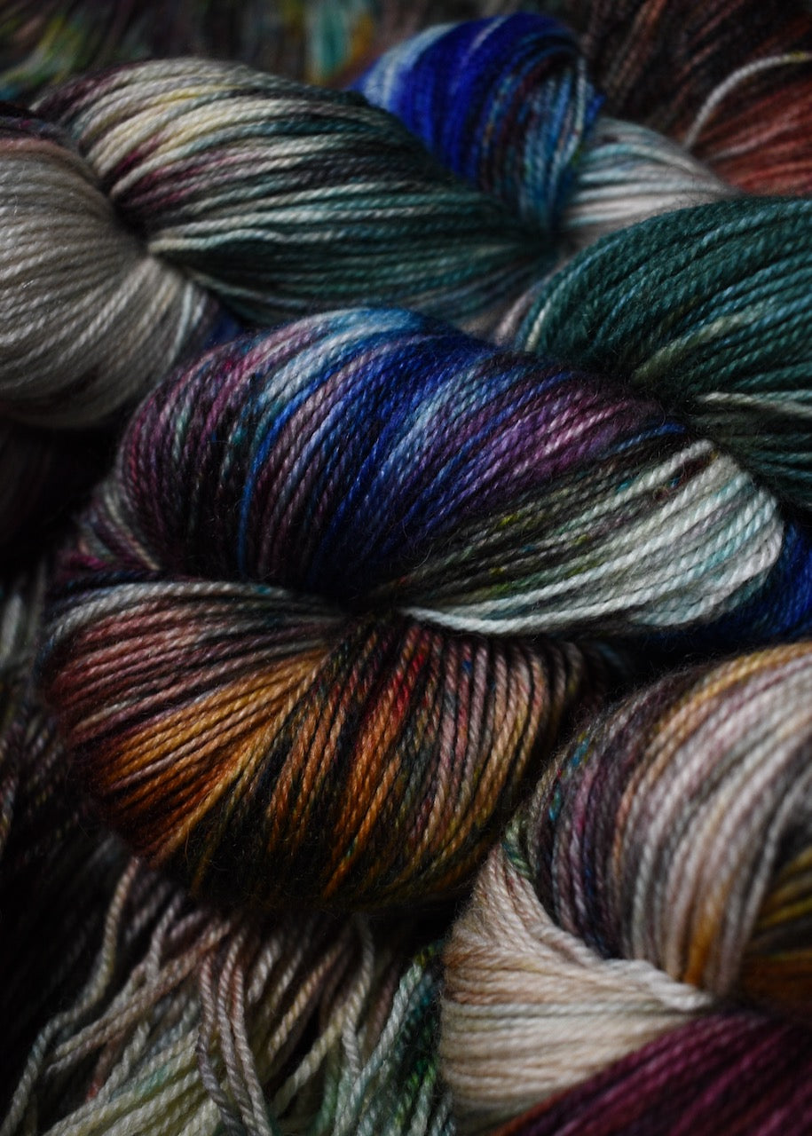 A variety of colour speckles on hand dyed bfl wool sock yarn.