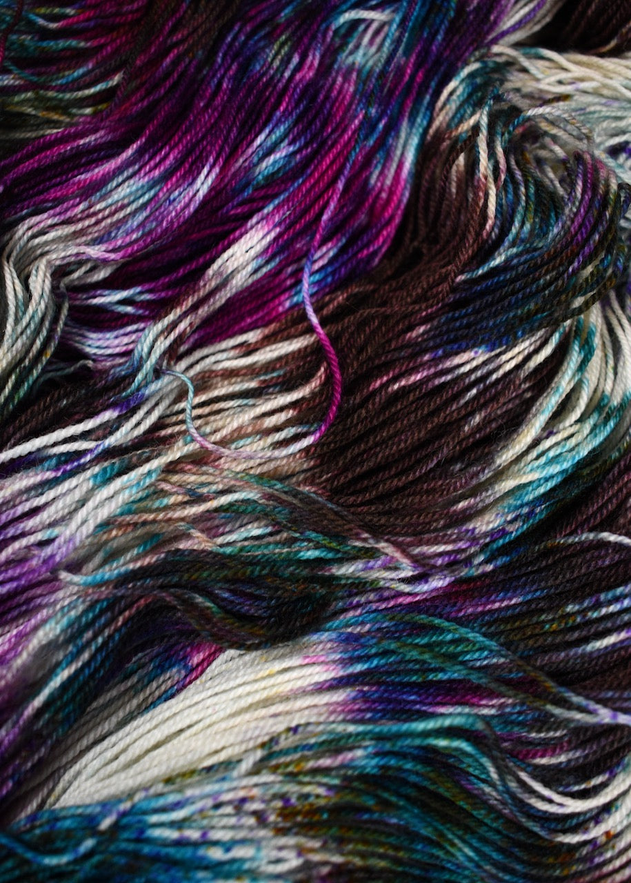 Hand dyed bfl wool sock yarn in pink and blue colours.