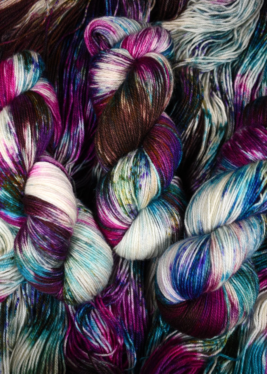 Hand dyed bfl wool sock yarn in pink and blue colours.