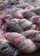 Hand dyed merino cashmere silk yarn pink and multi colour speckles.