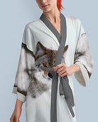 Woman wearing a kimono-style robe printed with a coyote photograph