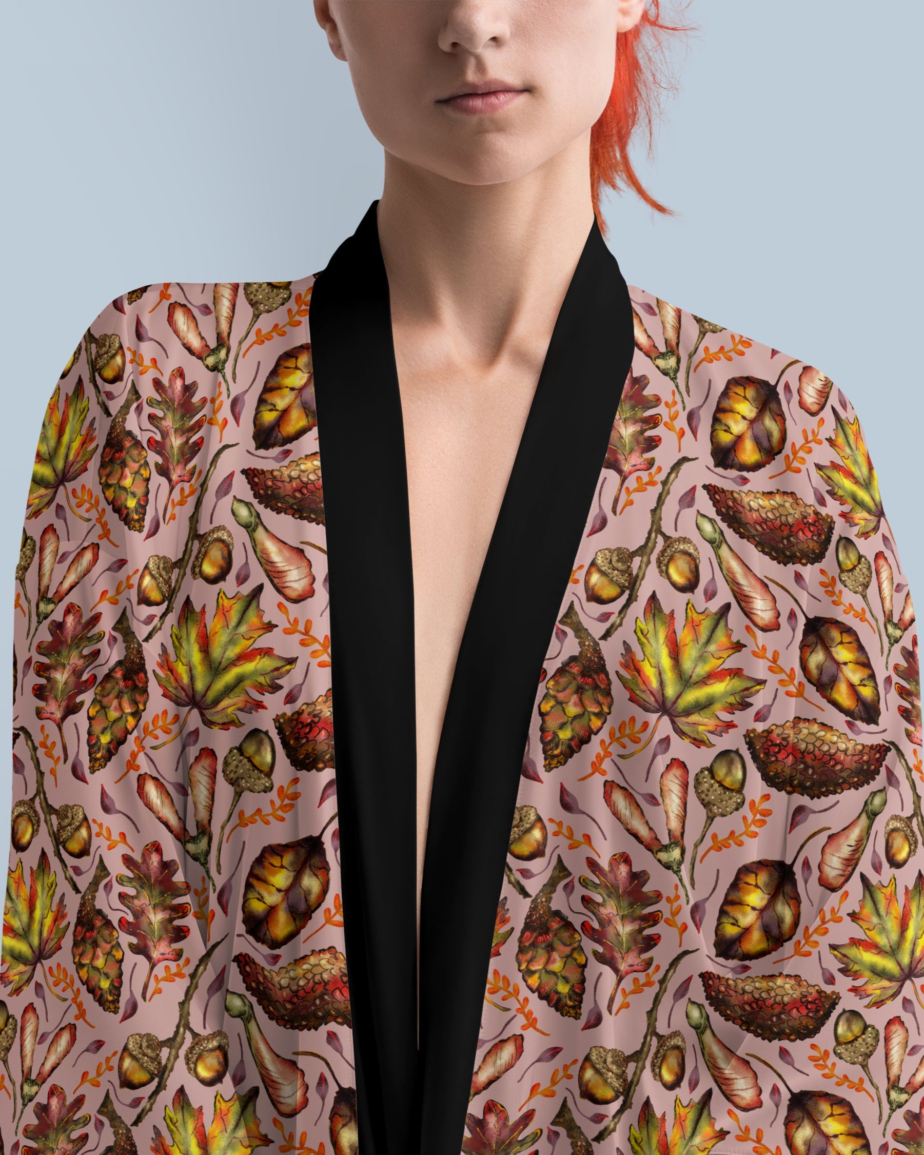 Person wearing a patterned kimono-style garment with a plain background