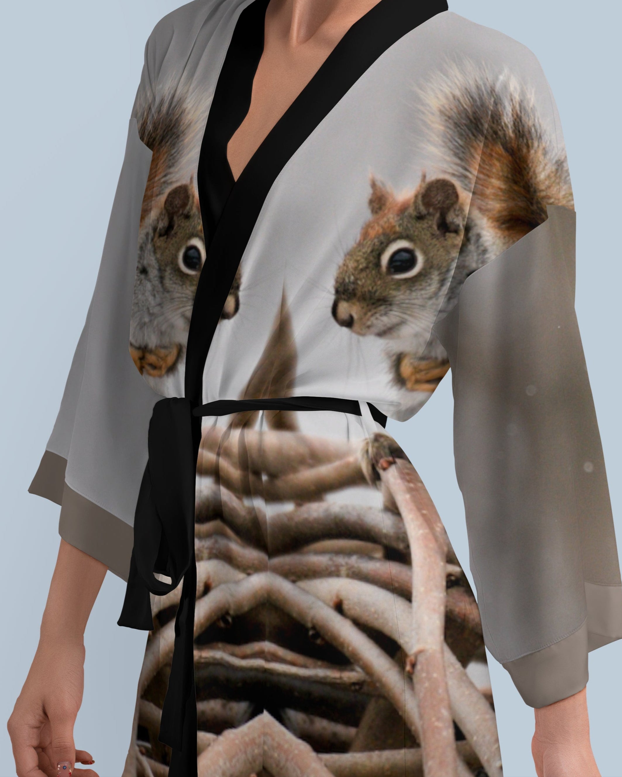 Woman wearing a kimono-style dress with a squirrel design 