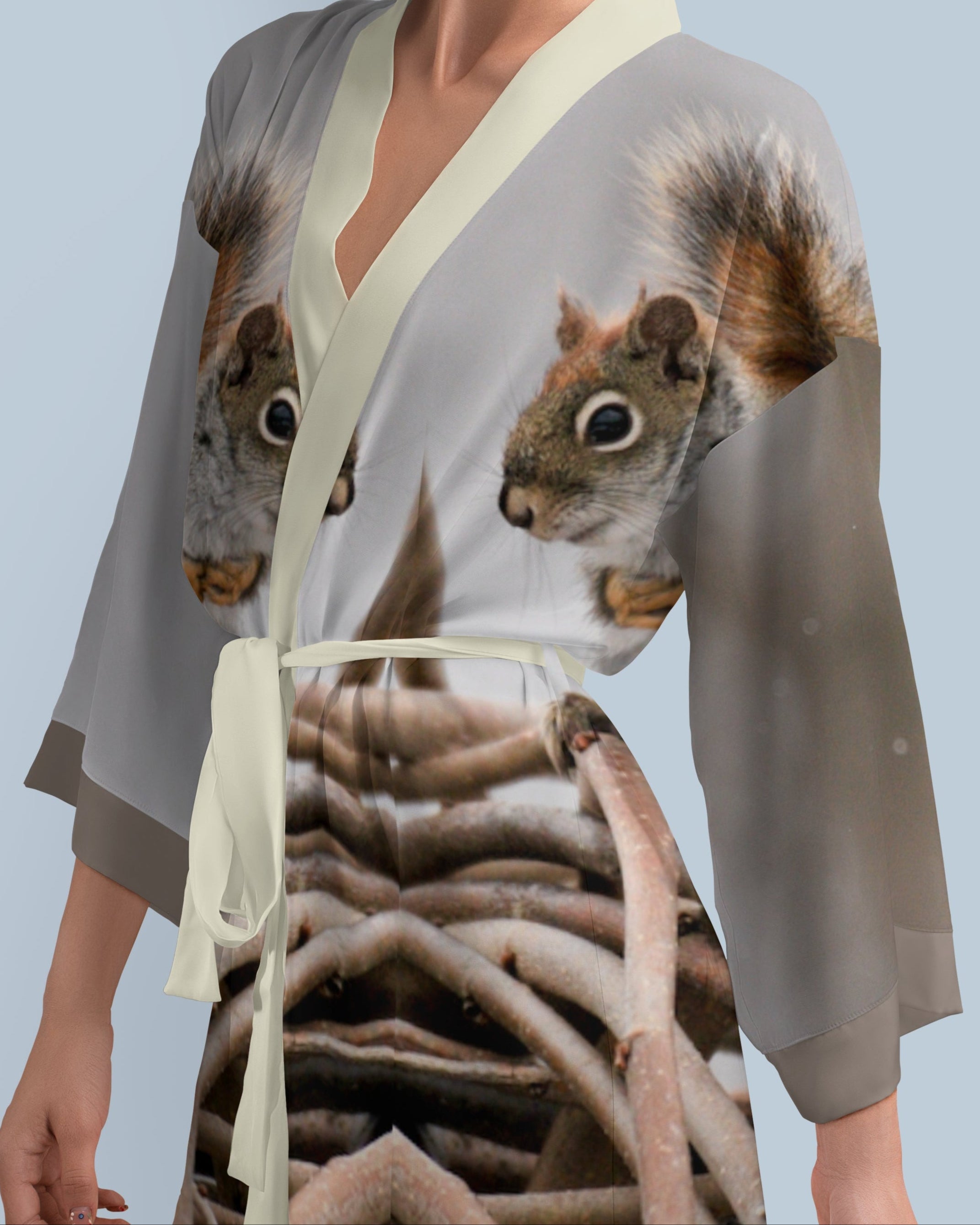 Woman wearing a kimono-style robe with a photo print squirrel design 