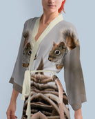 Woman wearing a kimono-style robe with a photo print squirrel design 